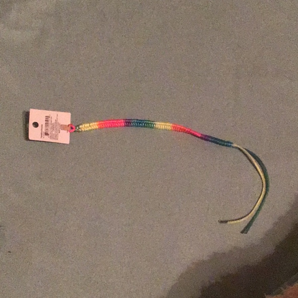 Friendship bracelet with tag on it